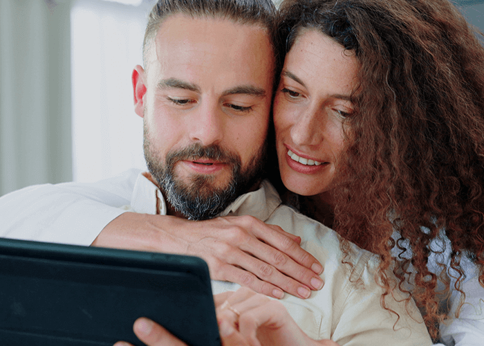 Couple looking at screen