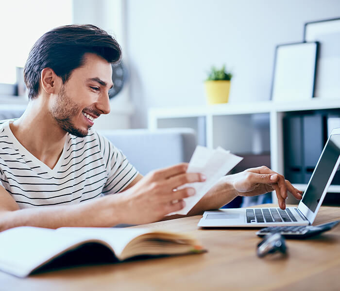 Man looks at finance spreadsheet